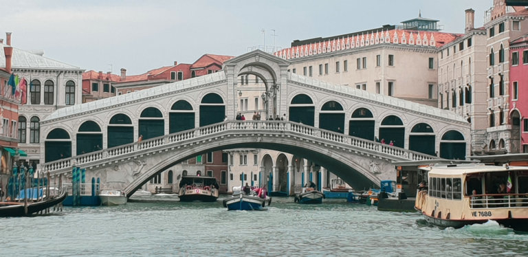 The Rialto Bridge reaching across teh Grand Canal, Venice, Italy
