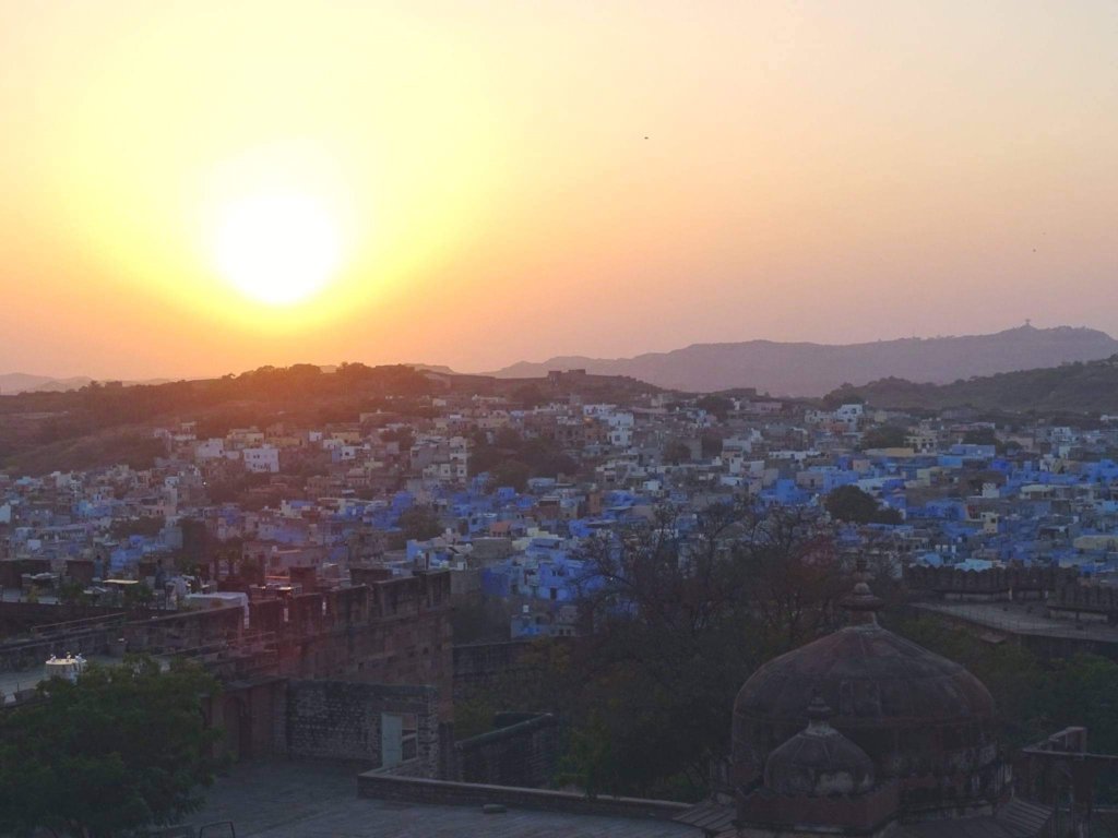 Sunset over a city, yellow and orange sky