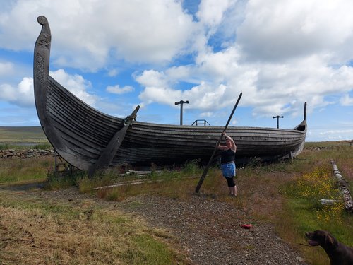 Shetland Highlights Viking history
Wooden viking longboat with woman holding oar twice as long as her height, 