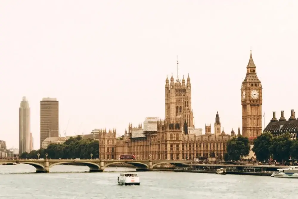 thames river showing big ben and houses of parliament in distance