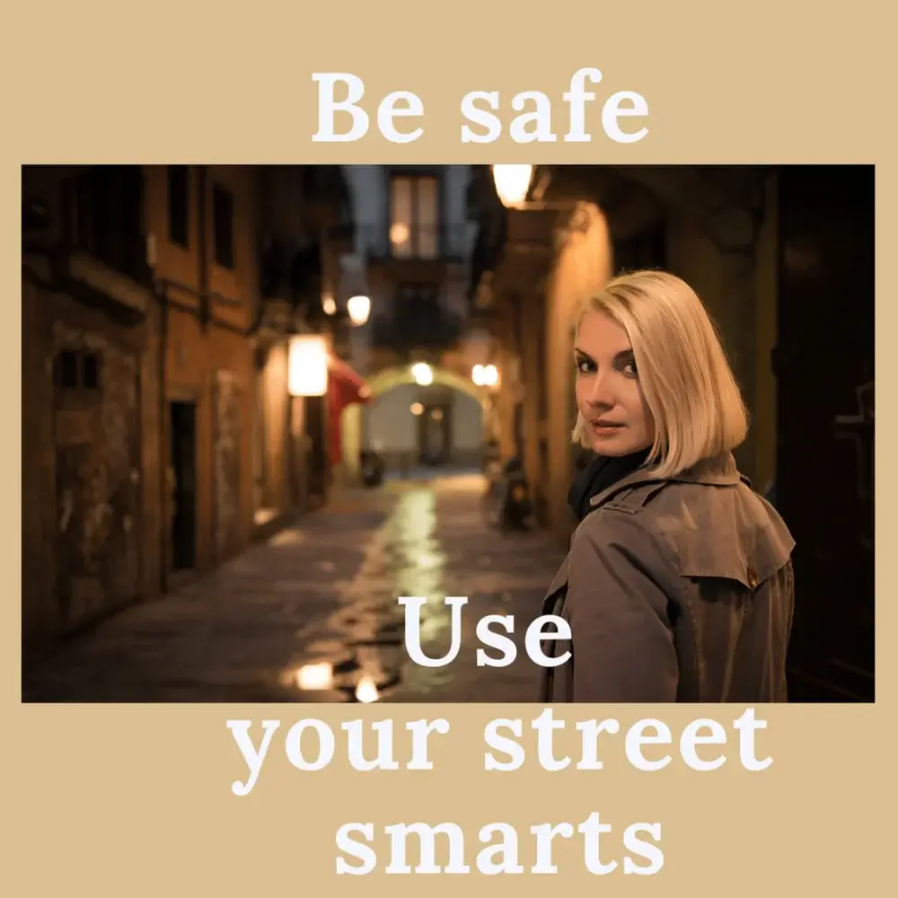 solo travel fears blonde woman walking on city street, lit by streetlamps, at night, text says Use your street smarts