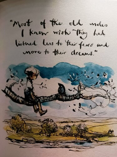 Quote from book.' Most of the old moles I know wish they had listened less to their fears and more to their dreams.  Written in black cursive.  Watercolour of boy sat on branch with mole above yellow fields with blue sky