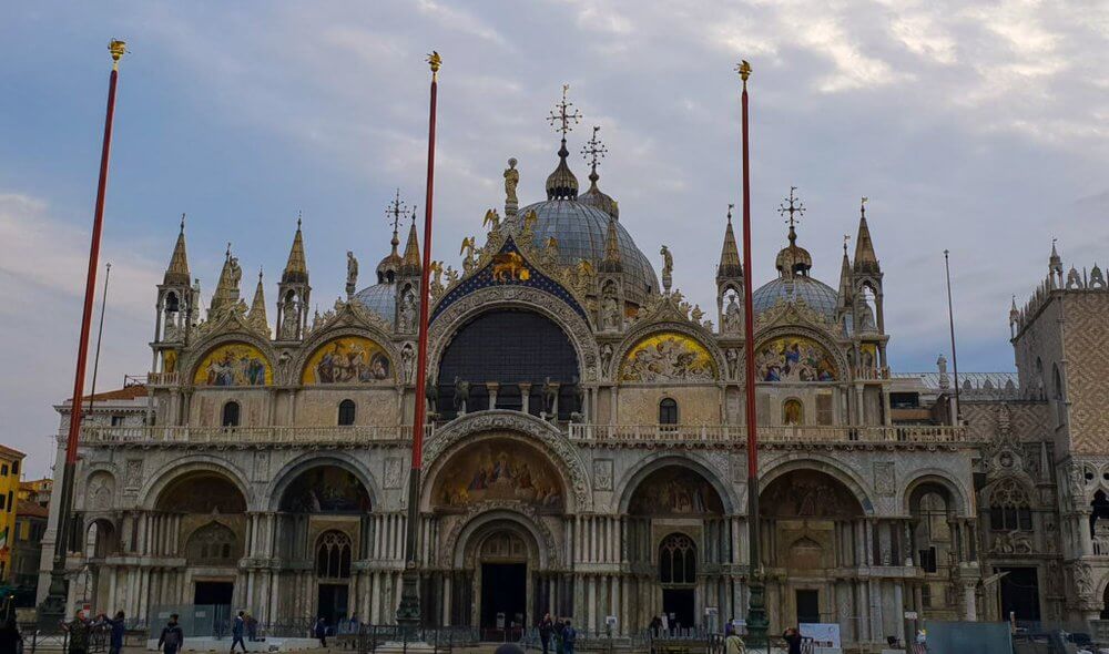 Being a tourist in Venice
Front of St Mark's Basillica during day.  Intricate carvings and paintings with decorative stonework