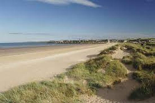 Day Trips from Edinburgh In search of beaches
Long straight beach edged by grassy dunes sea in distance