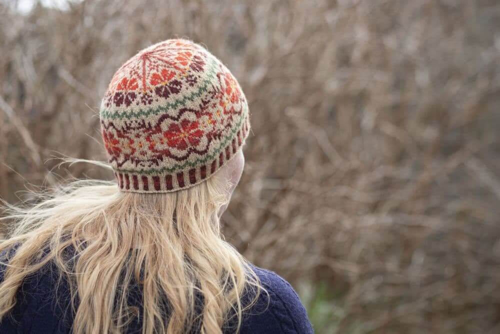 View of woman wearing a shetland beanie hat from behind 