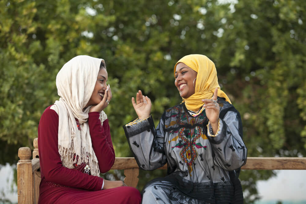 Egyptian women talking, getting to know locals when we solo travel as a woman over 40