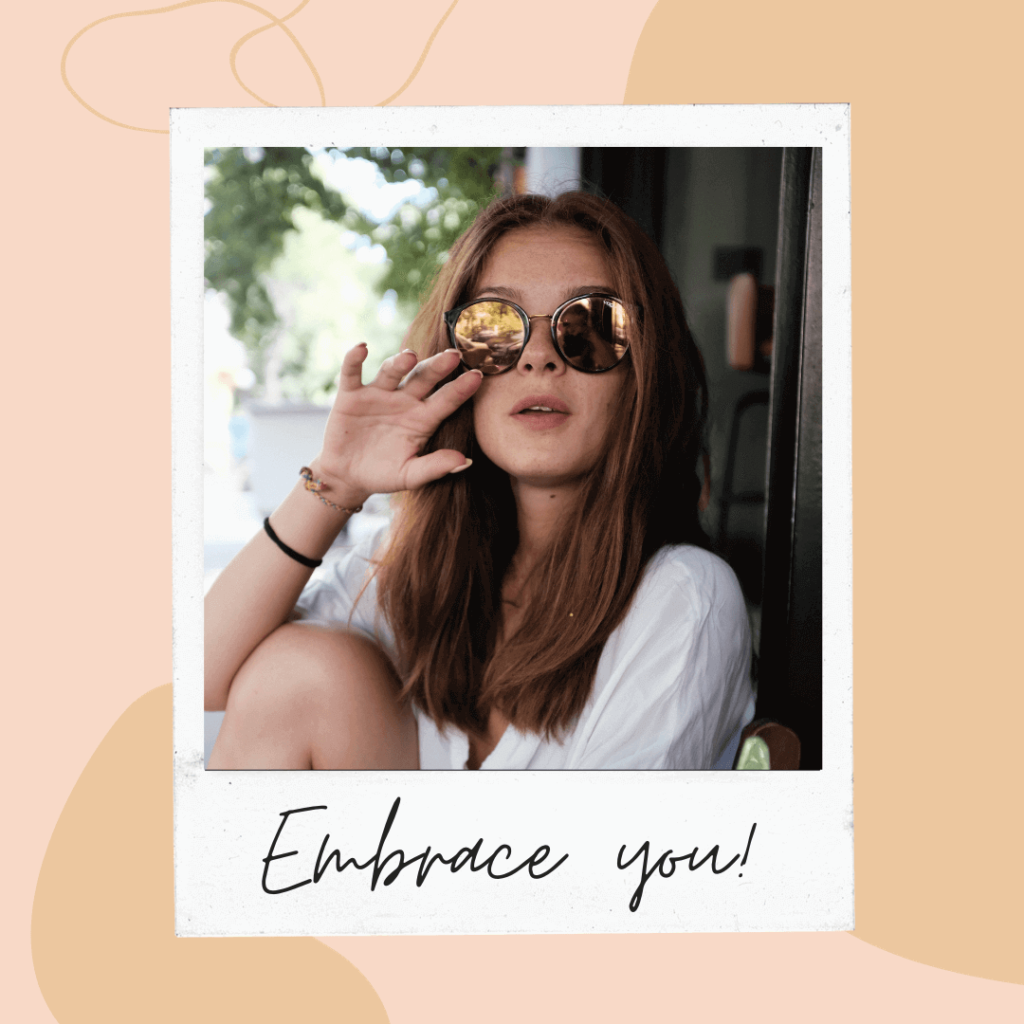 Woman with long brown hair wearing reflective sunglass, text says embrace you