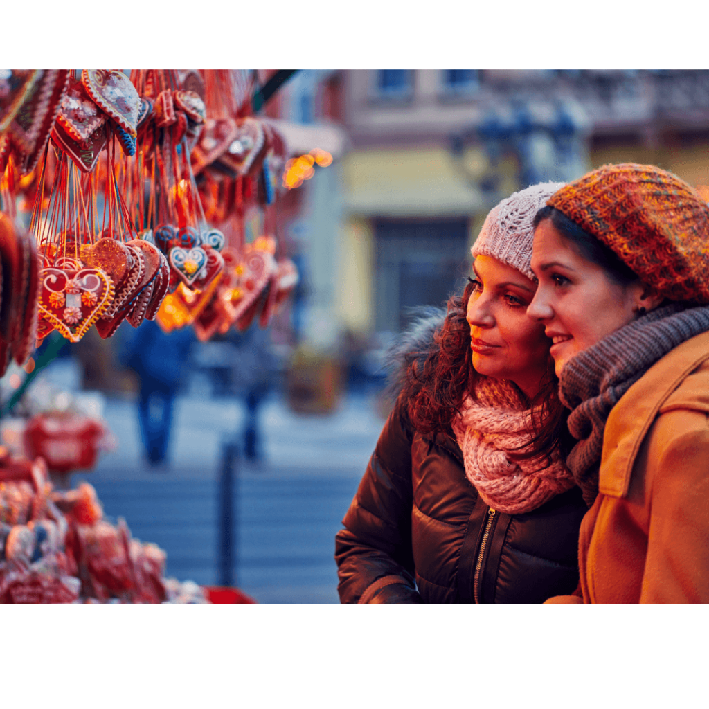 e Best Way to Visit Edinburgh Christmas Market in 2023
Image of Girls at a stall