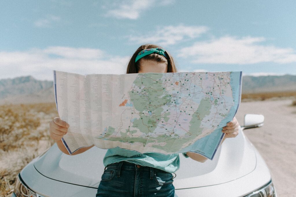 solo travel as a woman over 40, planning by looking at a map